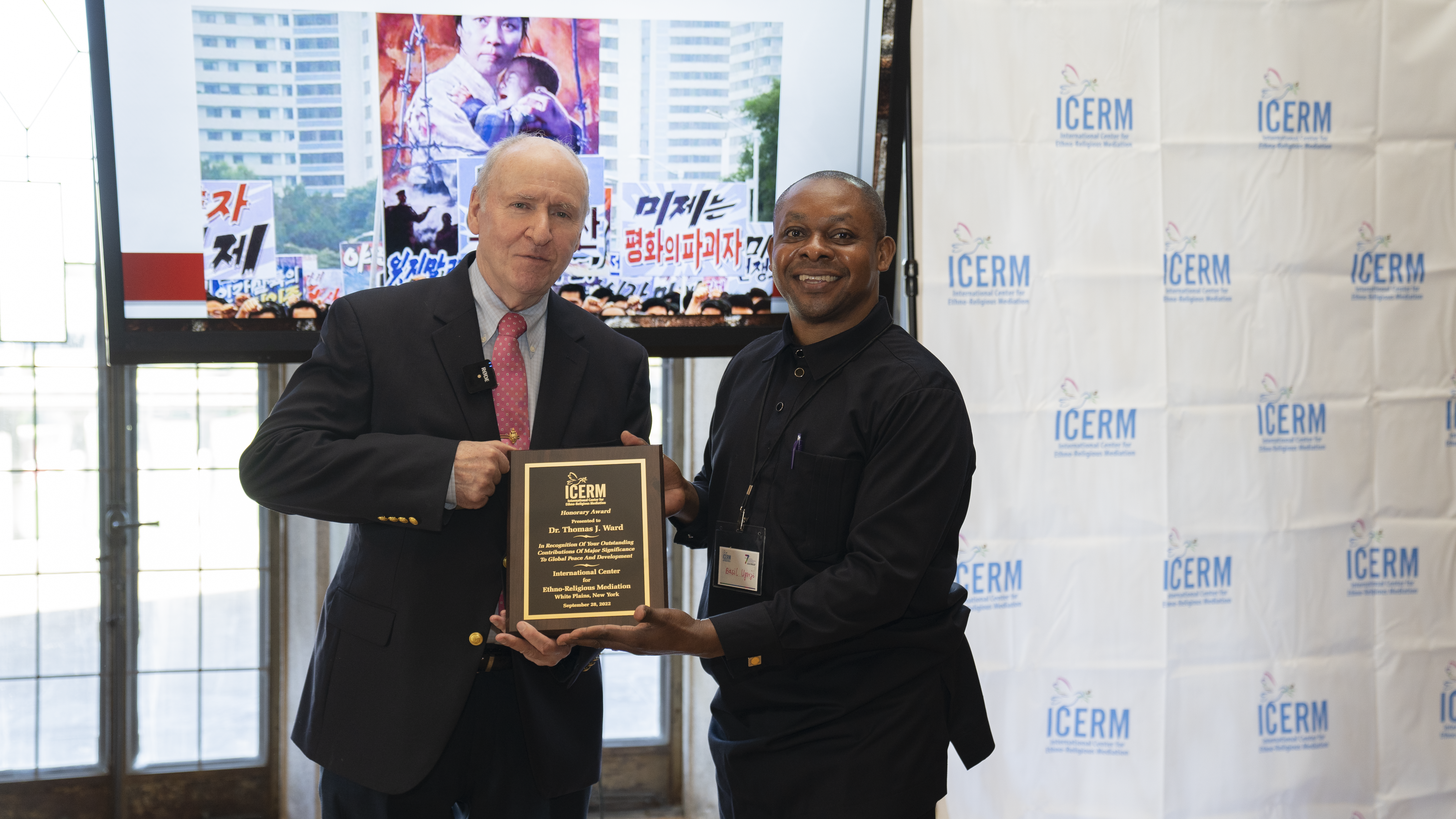 Dr. Basil Ugorji presenting the ICERMediation Award to Dr. Thomas J. Ward